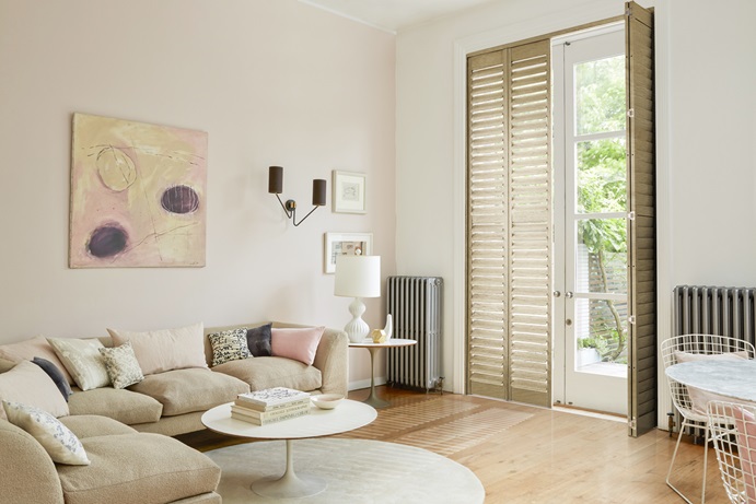 Full-height oak shutters on garden doors